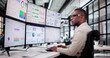 © Andrey Popov - Diverse Financial Analyst Analyzing Stock Market Trends