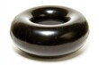 © jenk - A large, glossy, black inflatable ring.