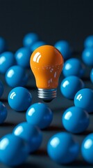 Aufkleber - A vivid orange light bulb is prominently displayed amidst a multitude of blue spheres. The vibrant colors enhance the visual appeal, creating an energetic and playful atmosphere