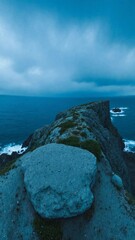 Poster - Eerie Cliffside with Glowing Light and Stormy Sea - 360 loop video