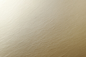 Aufkleber - Subtle metallic mineral sheen against soft plain, textured gold surface with gentle light reflection
