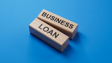 Poster - Time to business loan. Concept words 'business loan' on wooden blocks. Business loan concept.3D rendering on blue background. wooden blocks.