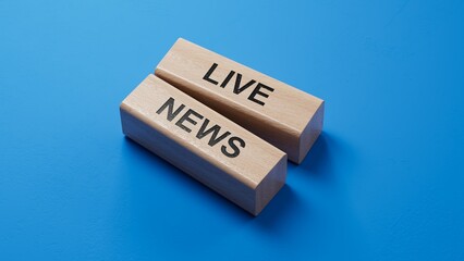 Poster - Live News symbol. wooden blocks with words 'Live News'. wooden blocks. Copy space.3D rendering on blue background.