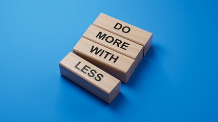 Poster - Do more with less symbol. Concept words Do more with less on wooden blocks. Business and Do more with less concept. Copy space.3D rendering on blue background.