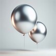© JetHuynh - Two Realistic flying metallic silver balloons isolated on a  white Background