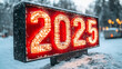 © Tractor - Illuminated sign with the year 2025 in the snow.