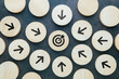© patpitchaya - Every arrow wood block points at the same target at the center, all for one purpose, teamwork, business competition, or the  point of communication concept