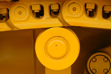 Poster - Tractor track on roller close up machine part many bolts and screws сoncept complexity precision, many parts fasteners work together create functioning machine