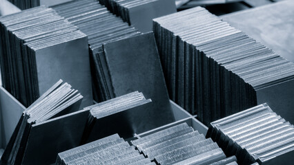 Poster - pile of metal sheets with a variety of sizes and shapes. Concept of organization and structure industrial concept background