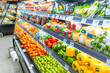 © samael334 - Supermarket vegetable refrigerated section with rows of packaged fresh produce including colorful bell peppers, tomatoes, limes and chili pepper. Freshness, convenience and healthy eating. Food retail