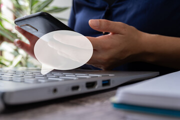 Poster - Woman's hands working on laptop and cell phone with speech bubble icon