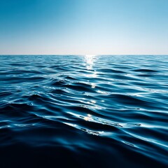 Aufkleber - Reflections on Tranquil Waters: A Serene Ocean Landscape Under a Clear Blue Sky with Gentle Waves Catching Sunlight