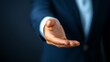 © nuanjan - Businessman in suit extends hand for handshake symbol of agreement deal and partnership in corporate world