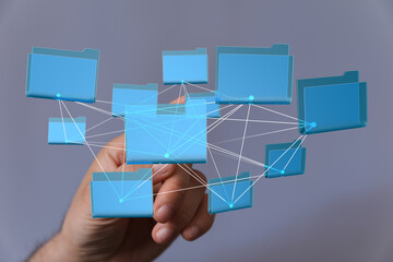 Poster - Hand interacting with a network of digital files.  Illustrates cloud storage, data sharing, and network technology.