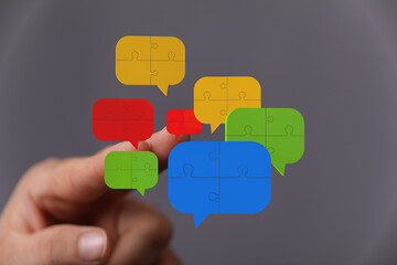 Aufkleber - Abstract image of puzzle pieces forming speech bubbles, symbolizing communication and collaboration.