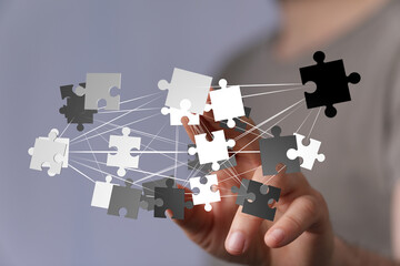 Poster - Abstract image of puzzle pieces interconnected, symbolizing teamwork, collaboration, and problem-solving.
