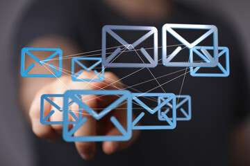 Aufkleber - Hand interacting with digital email icons, representing global communication and networking.