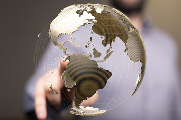 Aufkleber - High-quality stock photo of a businessman interacting with a digital globe, representing global connectivity and networking.