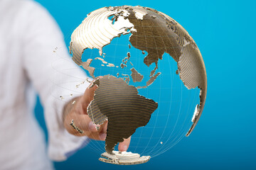 Poster - High-quality stock photo of a hand interacting with a 3D model of Earth, representing global connectivity and networking.