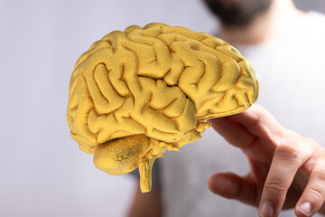 Poster - Abstract image of a golden brain, representing intelligence, innovation, and ideas.