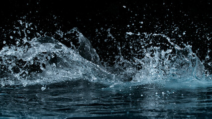 Aufkleber - Clear water splash on a black background , close-up