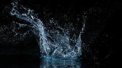 Aufkleber - Clear water splash on a black background , close-up