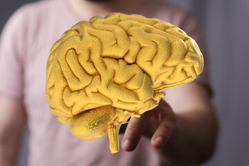 Poster - Conceptual image of a golden brain, representing intelligence, ideas, and mental power.