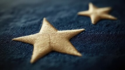 Poster - A close-up view of a gold star on a blue cloth, suitable for use in designs and compositions where a touch of elegance is needed
