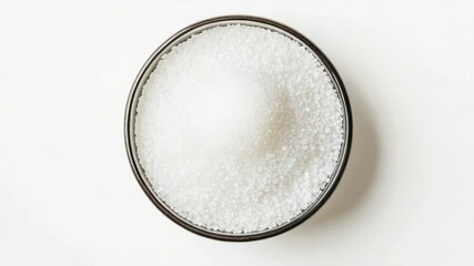 Poster - A bowl of sugar on a white surface