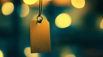 Poster - A single tag dangling from a length of twine or rope, suitable for various uses such as labeling, decoration, or storytelling