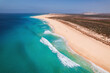 © Evgeni - Beautiful tropical beach on Boa Vista Island, Cape Verde, featuring golden sand, clear turquoise water, and a sunny blue sky – ideal travel and vacation destination