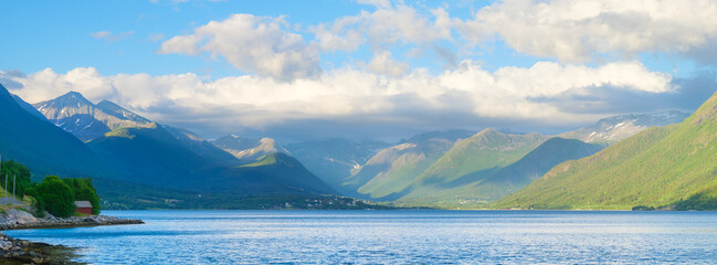Wall Mural - norway. nature in fjords. high mountains and reflections. panoramic view. clouds over the rocks. vac