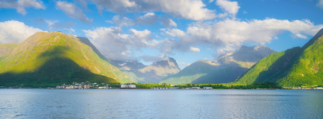 Wall Mural - norway. nature in fjords. high mountains and reflections. panoramic view. clouds over the rocks. vac