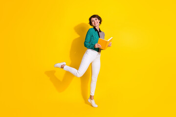 Poster - Full length photo of lovely cheerful woman wear stylish clothes read book isolated on yellow color background