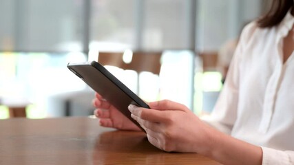 Aufkleber - Professional female businesswoman entrepreneur multitasking with tablet for remote work, searching internet financial research, online project planning, and browsing modern business office insights.