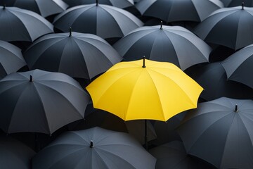 Poster - One bright yellow umbrella standing out among many black umbrellas, showing contrast and individuality in a creative business concept background.