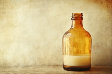 Poster - Antique amber glass bottle with creamy liquid.