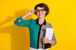 © deagreez - Photo of charming confident woman wear stylish clothes hold paper blank isolated on yellow color background