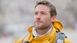 © Natalia S. - Close-up portrait of a determined male firefighter in a yellow protective jacket, gazing upward with resolve. Leadership, and readiness in emergency response roles, ideal for illustrating bravery