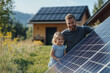 © Varitnan - Father and Daughter with Solar Panel Outdoors