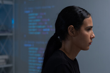 focused of hispanic young professional female software developer coding program on desktop computer 