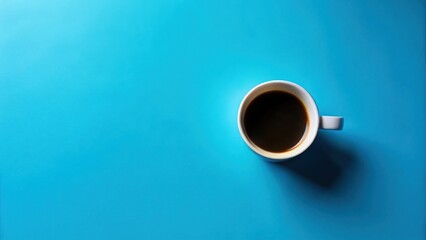 Aufkleber - A single cup of dark coffee rests on a vibrant blue surface, offering a simple yet striking visual.