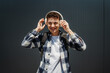 © Dusan - Portrait of a young adult man student smile with wireless headphones