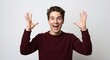 © NN AI - Excited caucasian man hands raised celebration victory success achievement happiness. Male burgundy sweater enthusiastic gesture triumph concept