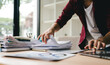© Dino - Employees who work with a lot of documents Searching for documents Accounting for income, expenses, tax records, and hard work