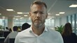 © Ganesha88 - Analyst reviewing wall-size artwork in open plan office environment for business insights