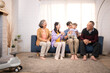 © Wosunan - Happy multi-generational Asian family enjoying quality time together at home