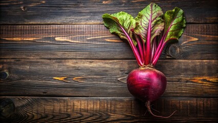 Poster - A Vibrant Beetroot Resting on a Rustic Wooden Surface, Showcasing its Rich Color and Freshness