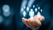 © sweetriver - symbols of people in hands of a elite manager in suits, human resources management concept
