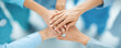 © LeManna - Community of healthcare workers reaching a goal hand in hand at hospital meeting. Support and collaboration in medical missions concept.